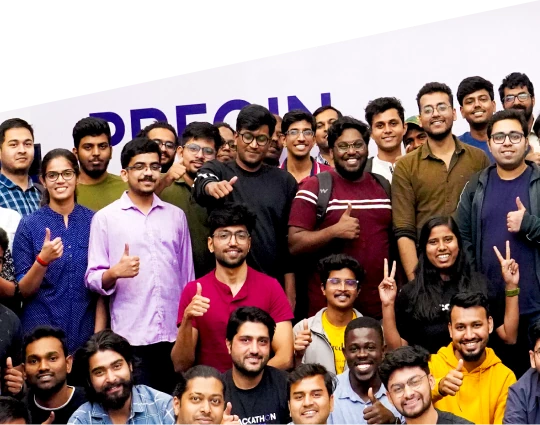 A large group of smiling people posing together for a photo