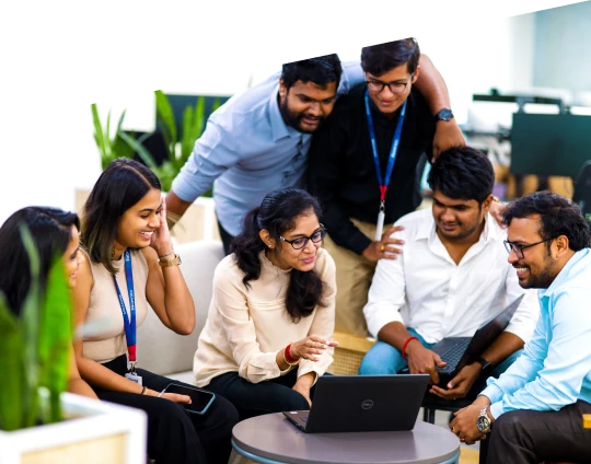 a group of people working together and smiling