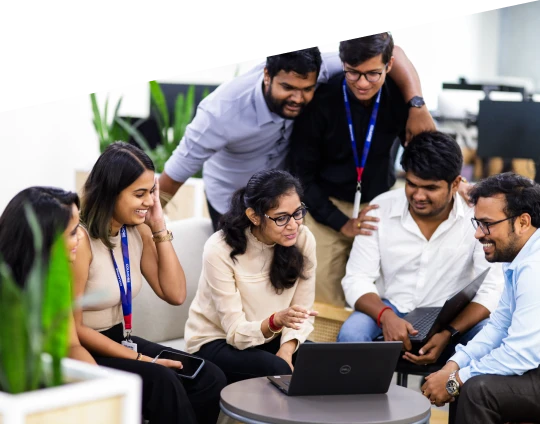 a group of people working together and smiling