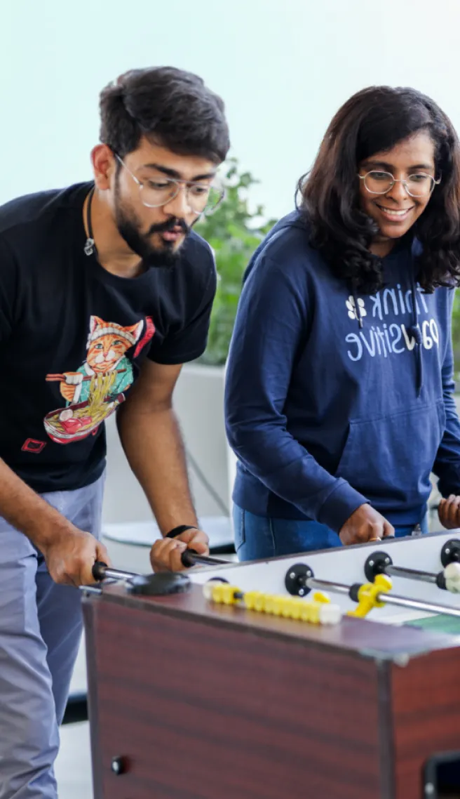 Team playing foosball