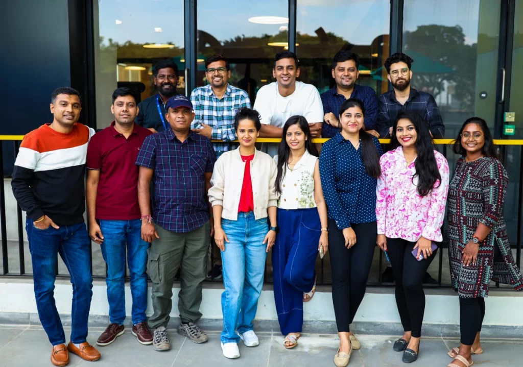 a group of people standing together in front of a building