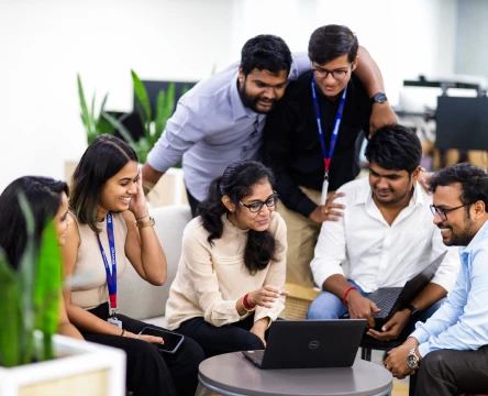 team meeting around a laptop