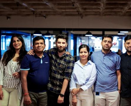 team members posing in the office