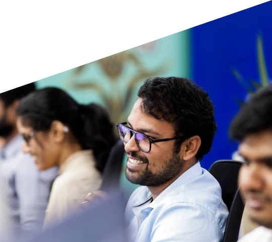 smiling man wearing glasses in an office