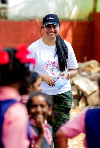 woman leading an outdoor activity with children