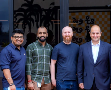 smiling men are standing