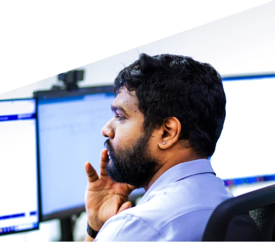 Technology professional working at a computer workstation