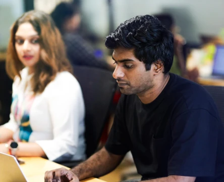 Employee working at a desk in a modern office