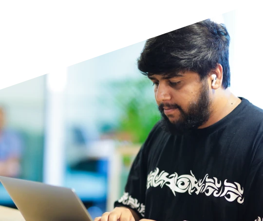 Young man using a laptop in an office