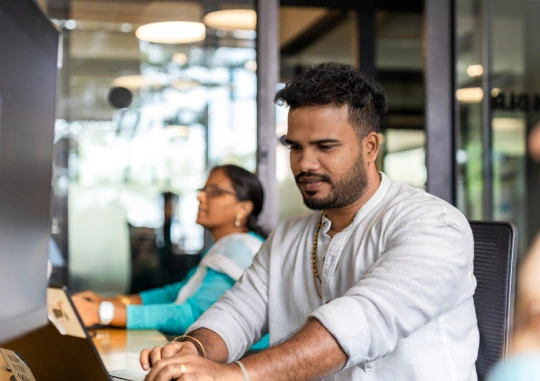Man working on a laptop in an office