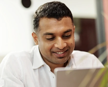Employee using a laptop in an office