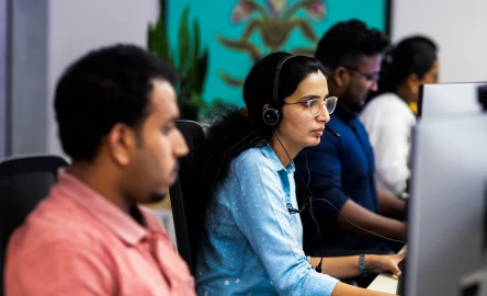 people working at computers in an office