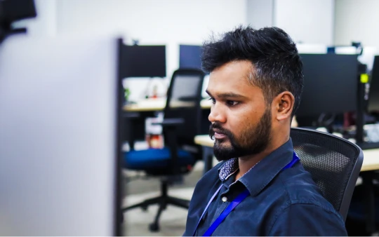 A man working at a desk in an office