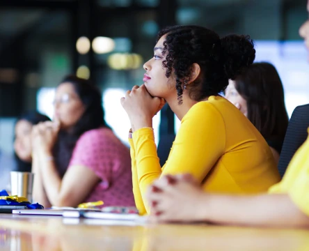 Team members listening during a meeting in a modern office