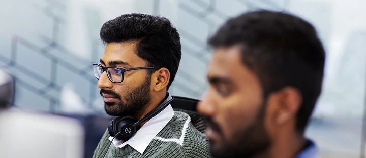 People working at computers in a modern office