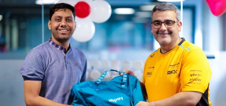Smiling people posing together at an office event