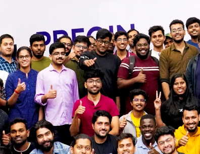 A large group of smiling people posing together for a photo