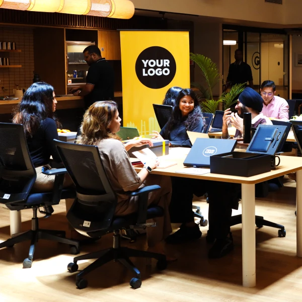 Team members collaborating around a table in the office